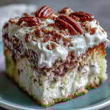 Butter Pecan Tres Leches Cake served chilled on a dessert plate, featuring a golden brown crust and generous drizzle of buttery pecan topping.